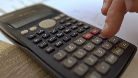 accounting close up shot; accountant using calculator close up shot, university exam using caculatorclose up shot of calculator using on desk