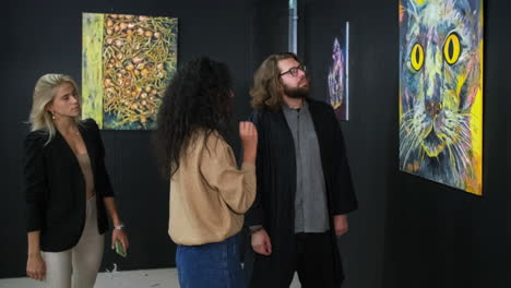 people viewing abstract art in an art gallery