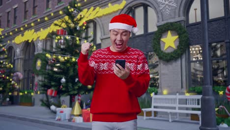 happy man celebrating christmas shopping