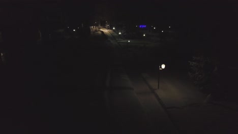 snowy park path at night