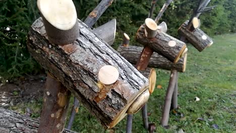 deers made of wood in the garden