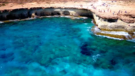 Crystal-clear-turquoise-blue-water-at-sea-caves-Ayia-Napa-Cyprus-view