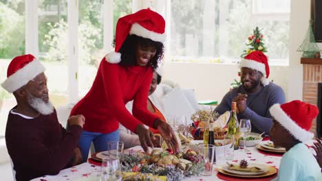 african american family wearing santa hats