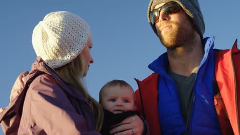 parents with baby travelling in motorboat 4k