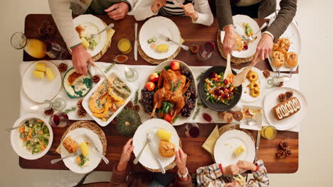 family and friends enjoying a thanksgiving dinner