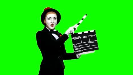 mime holding clapperboard on green screen