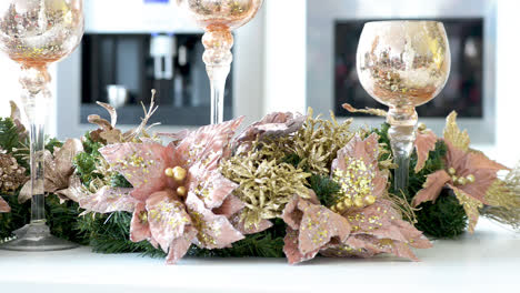 christmas decorated kitchen with poinsettias and glasses