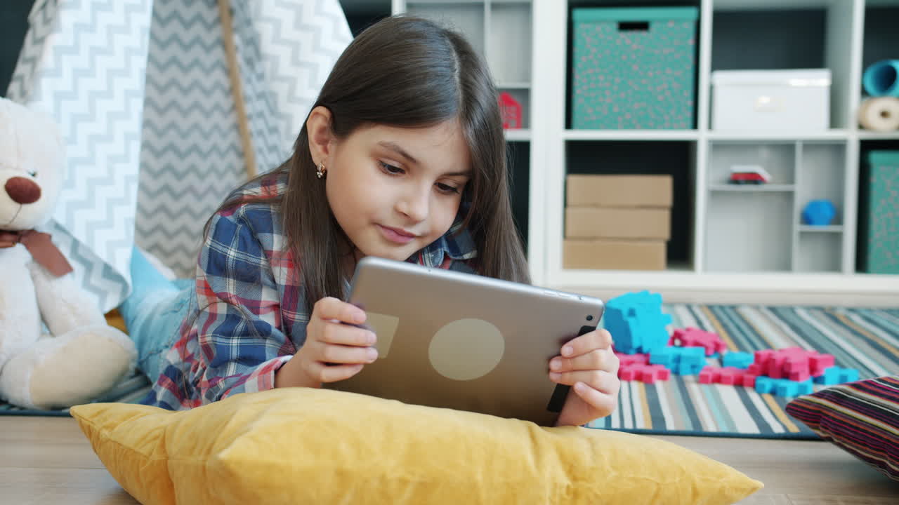 Girl Using Tablet in Playroom