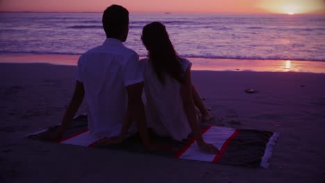 young couple by the sea