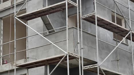 building under construction with scaffolding