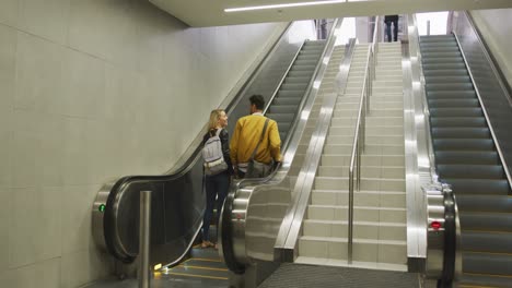 rear view of caucasian couple on the go during coronavirus pandemic