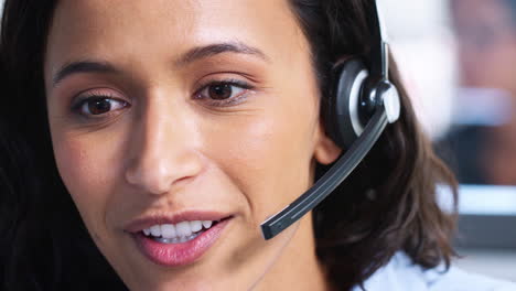 Young-mixed-race-woman-working-in-a-call-centre,-close-up