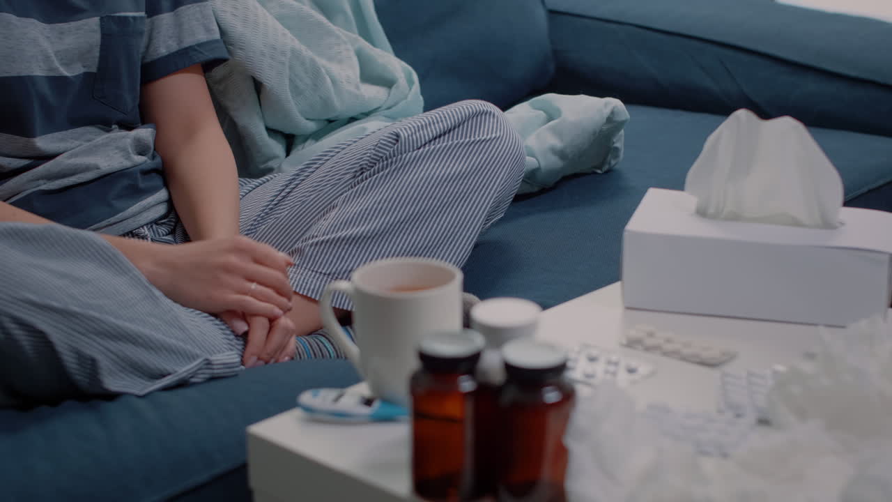 Close up of african american woman architect working with building model and blueprints plan