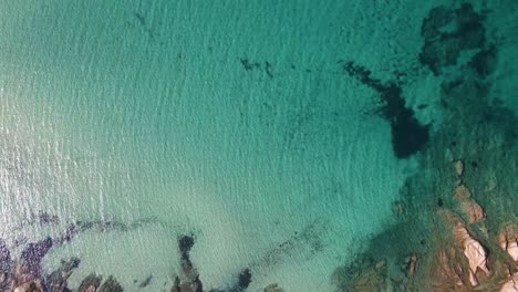 Revealing-clip-over-an-exotic-beach-in-Vourvourou,-Haklidikin-in-northern-Greece-on-a-clear-summer-day