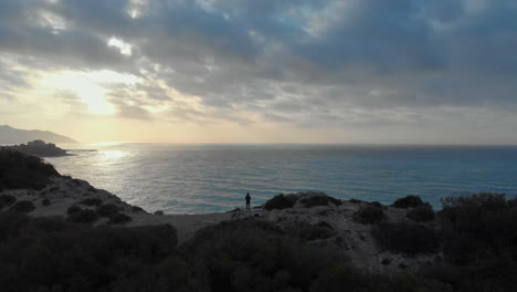 stunning drone footage of cliffs by the seaside at sunrise