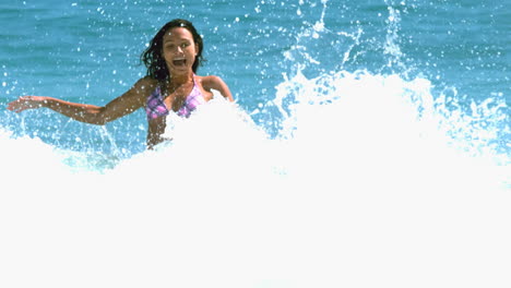 attractive woman having fun in the waves