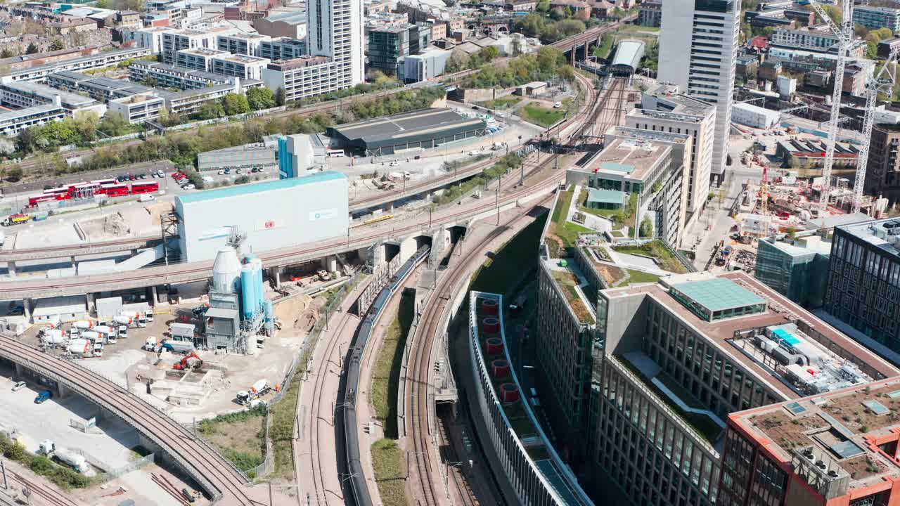 Aerial drone follow shot of Eurostar train entering tunnel st Pancras London side