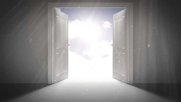 Door opening to reveal blue bright sky