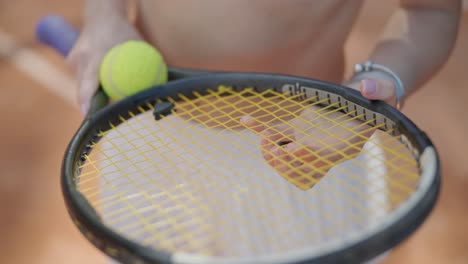 beautiful tennis girl practicing serve on outdoor court