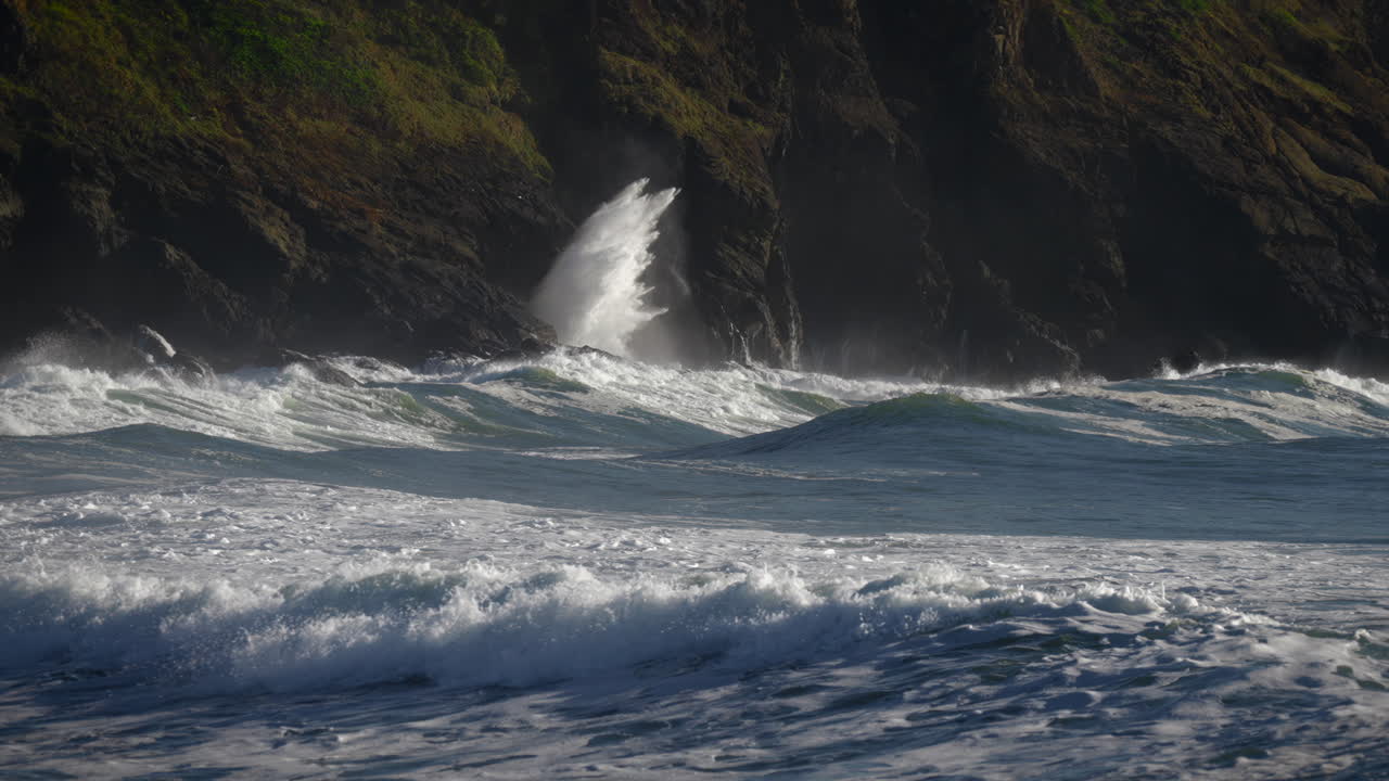Huge Sea Waves Crashing Into Coastal Rocky Cliffs. Close Up Shot