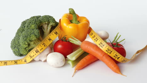 stop motion sequence of fresh vegetables and tape measure