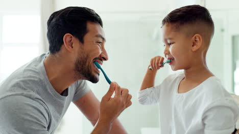 Dad,-child-and-brushing-teeth-in-bathroom