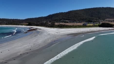 drone flight over diamond island bicheno and the azure waters in tasmania, australia