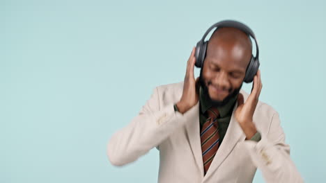 Business-man,-dancing-and-headphones-in-studio