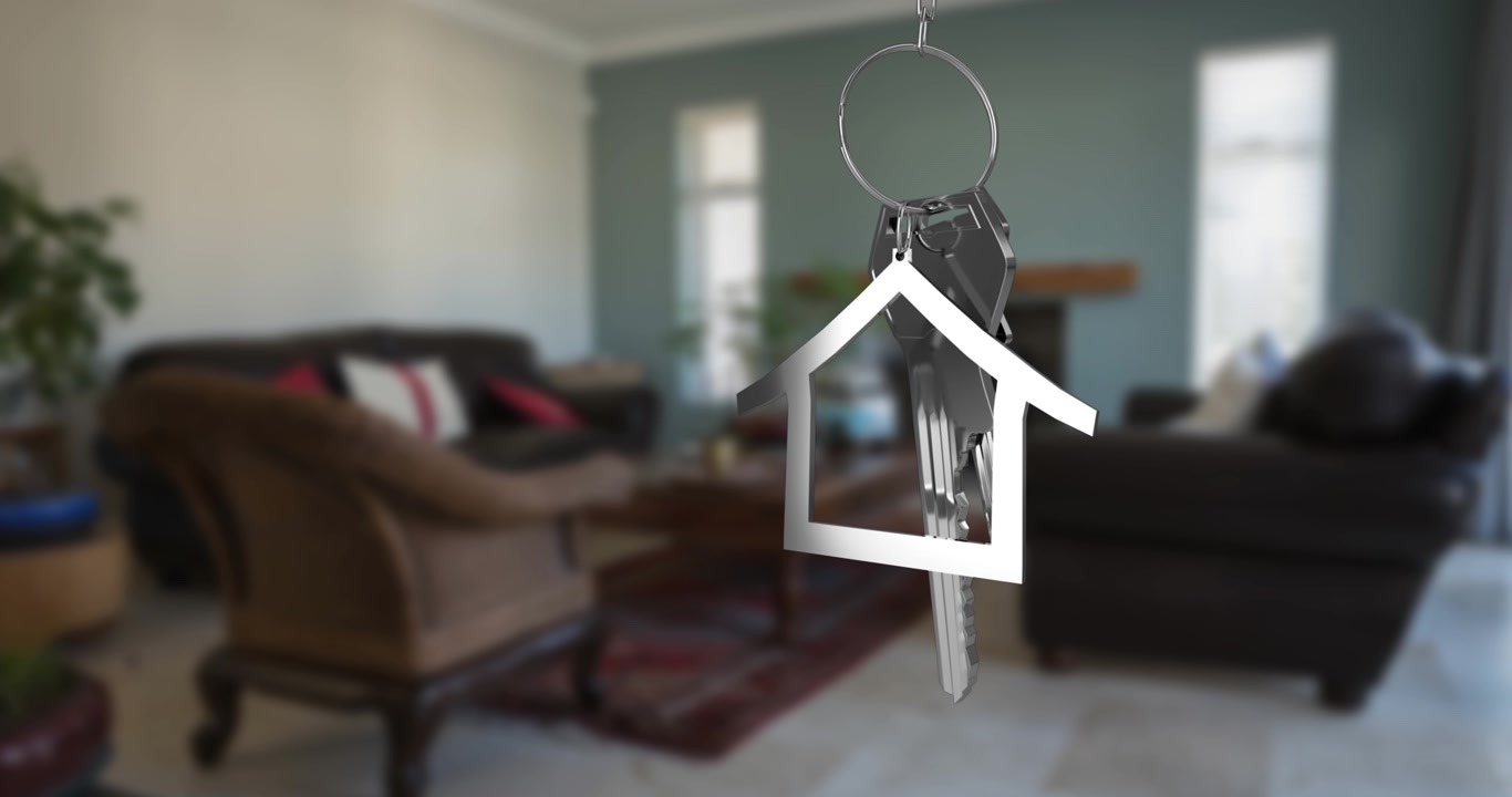 Animazione di una chiave di casa che penzola sopra un soggiorno.