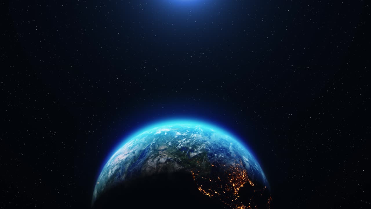 Space view of the sun rising over planet earth rotating going from night to day earth from space