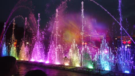 amazing light and sound show in the fountains in the central town square at dusk in xian, china