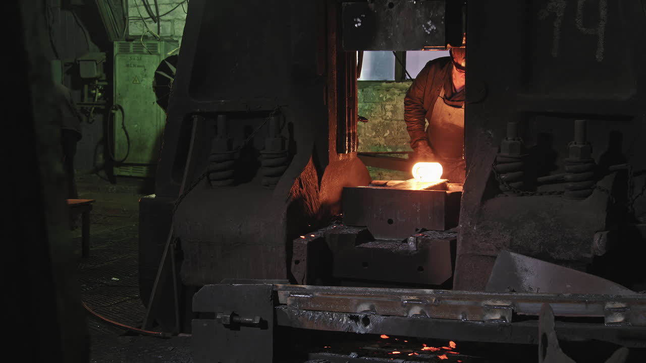 Forger Man Working With Hot Steel At Forgery Shop