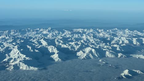 Exploring-from-above-the-snowy-Pyrenees-mountains,-Spanish-side,-at-10000m-high