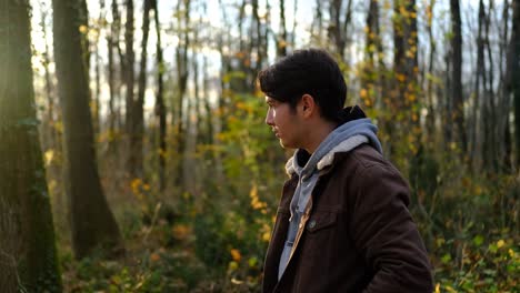 young man smoking in forest