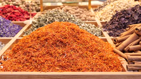 close up of saffron and cinnamon spices in a market stall