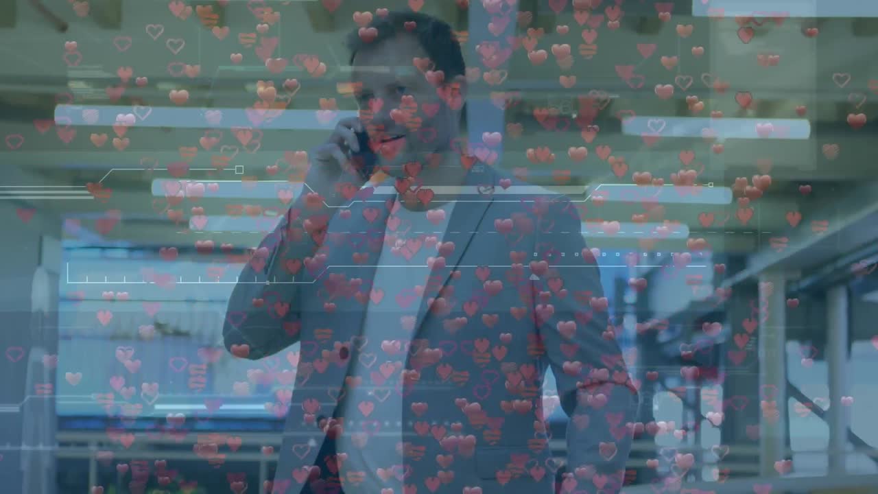 Animation of data processing and hearts over caucasian businessman talking on smartphone