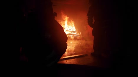 live fire training burn with firefighters inside a burning room