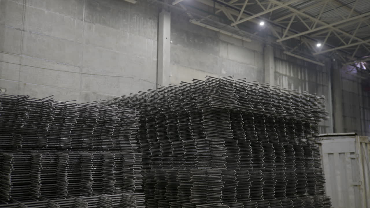 Stacked Steel Reinforcement Bars in a Warehouse