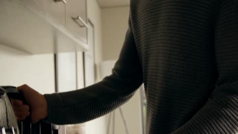 man preparing coffee in kitchen 4k