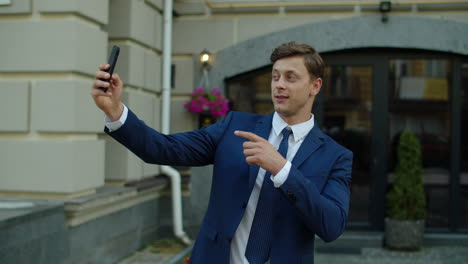 business man taking selfie photo on mobile phone outdoor.