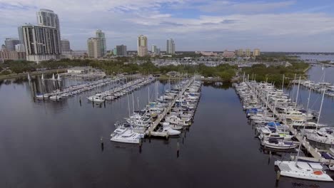 4k aerial drone video of sailboats and yachts at marina at demens landing park on tampa bay in downtown st