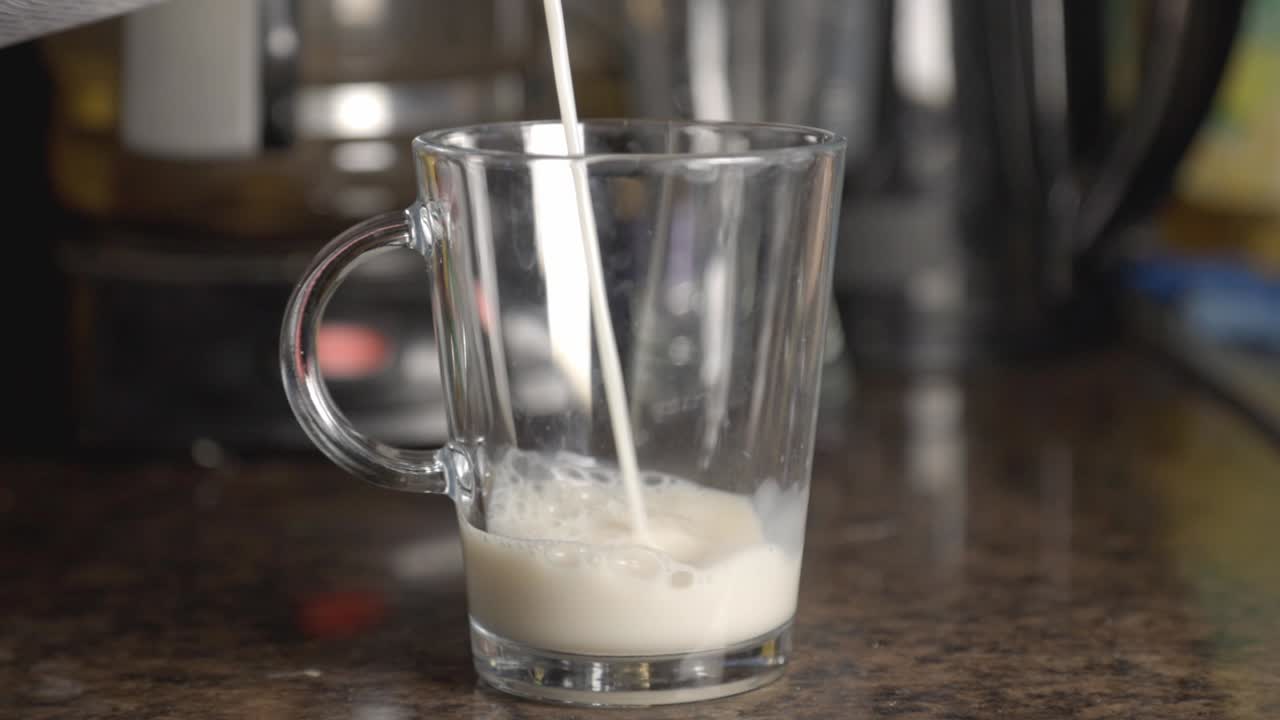Pouring Milk In The Empty Glass - Close Up Shot