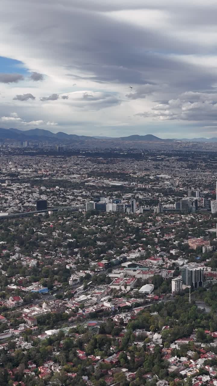Overhead drone shot of Mexico City on a clear, cloudy day