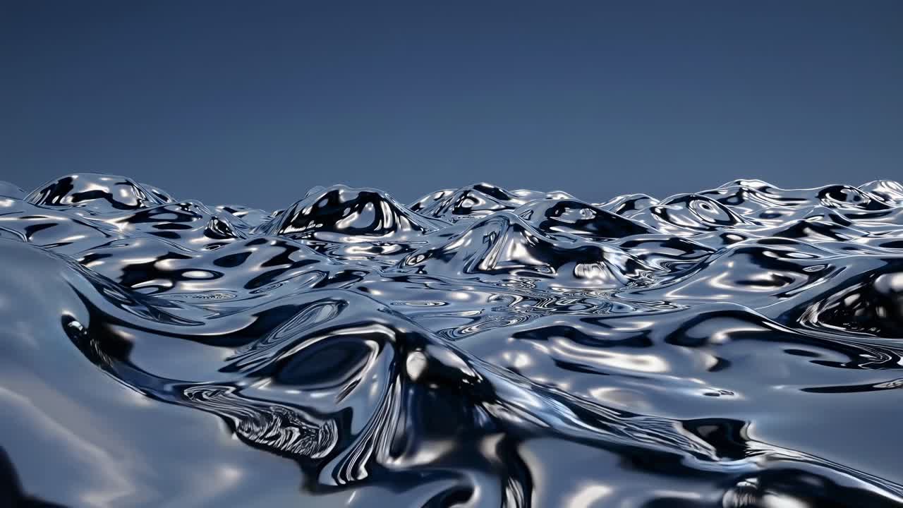 Shiny metallic liquid waves create a surreal futuristic landscape with reflective surfaces under a clear blue sky
