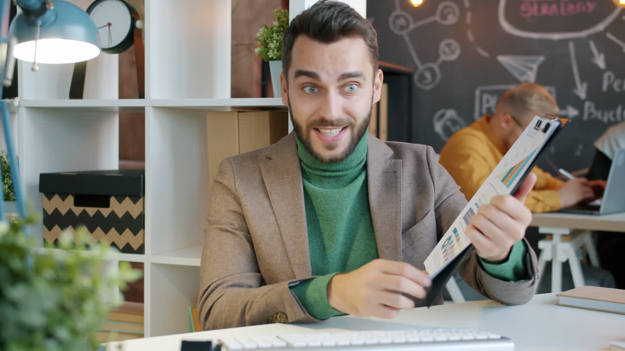 Businessman Presenting Charts in Office