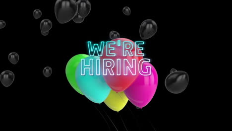 animation of we''re hiring neon text and balloons over black background