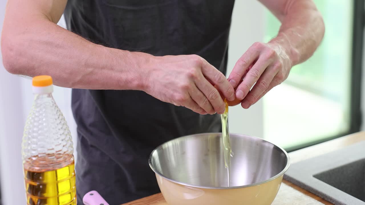 Cracking an egg into a bowl