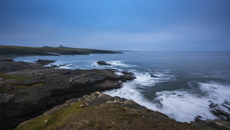 panorama motion timelapse of rugged coastline with moving clouds and classiebawn castle in distance in mullaghmore head in county sligo on the wild atlantic way in ireland