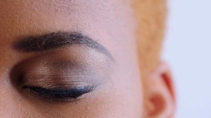 Black woman, eye zoom and half face portrait