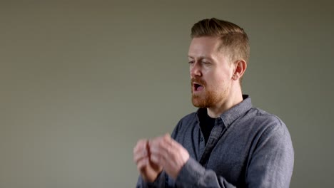 european man sneezing in slow motion a